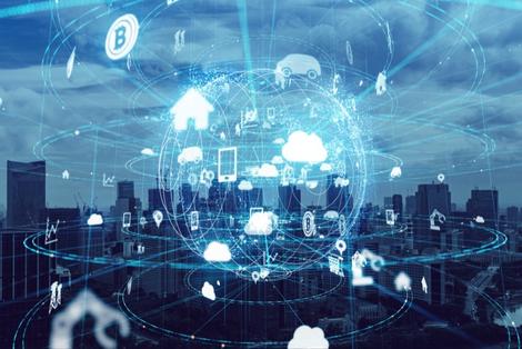 Cityscape with luminescent digital world wide web overlay with various internet symbols.