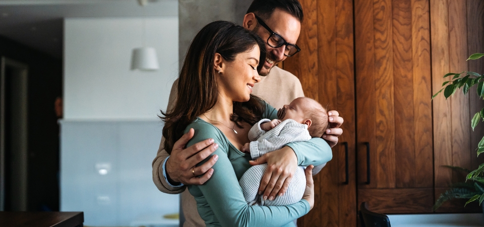 Man and woman holding baby